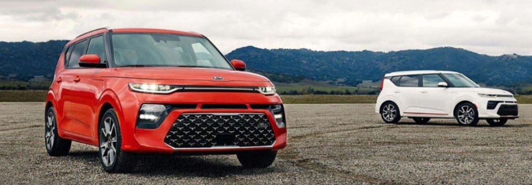 Two 2021 Kia Souls parked driving outside together