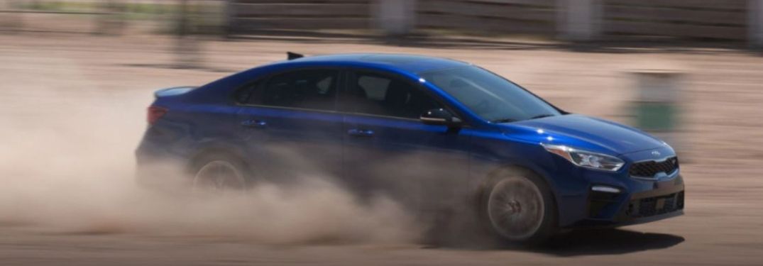 2021 Kia Forte driving on sand and dirt