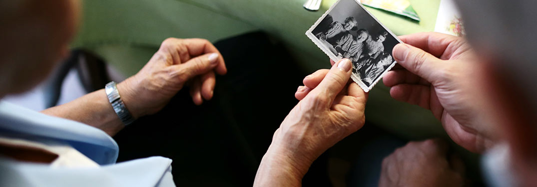 Hands holding old pictures