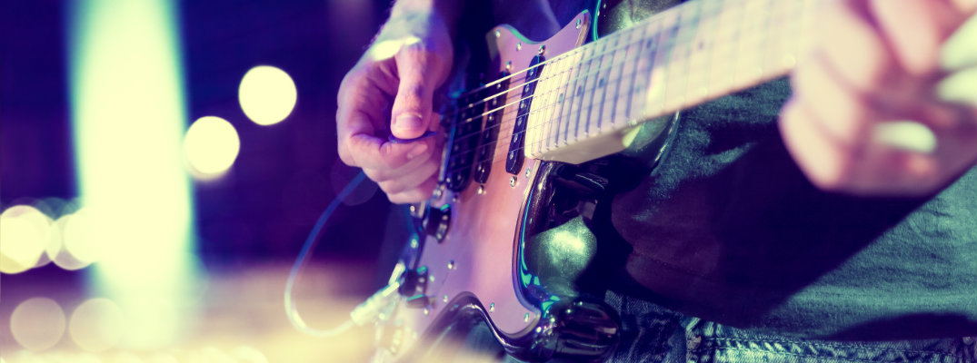 Stylized image of guitar player performing on stage