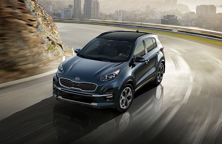Exterior view of the front of a blue 2020 Kia Sportage