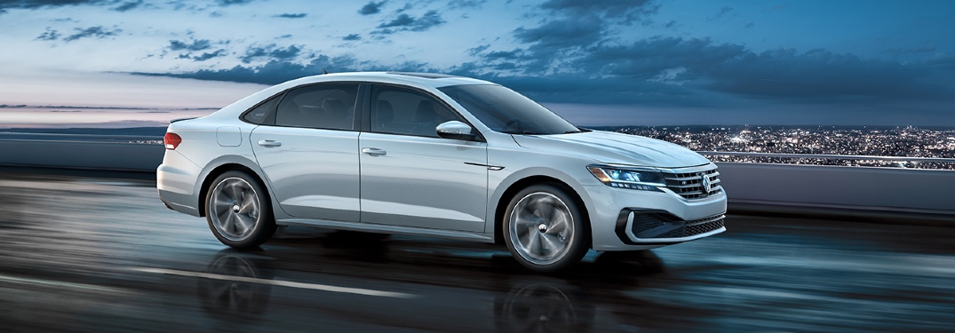 2020 Passat driving on the highway overlooking a city