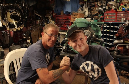 b image father and son duo holding hands in garage