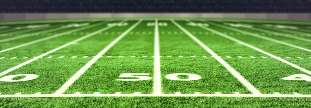 close up of football field at 50 yard mark