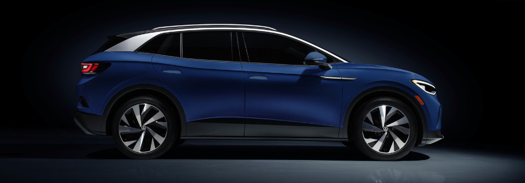 2021 VW ID4 blue exterior passenger side parked black background