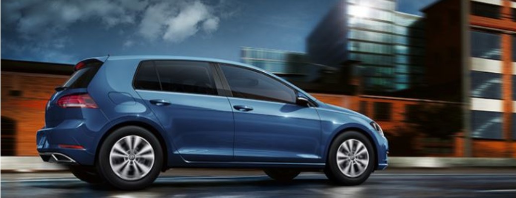 Blue 2020 Volkswagen Golf driving on road