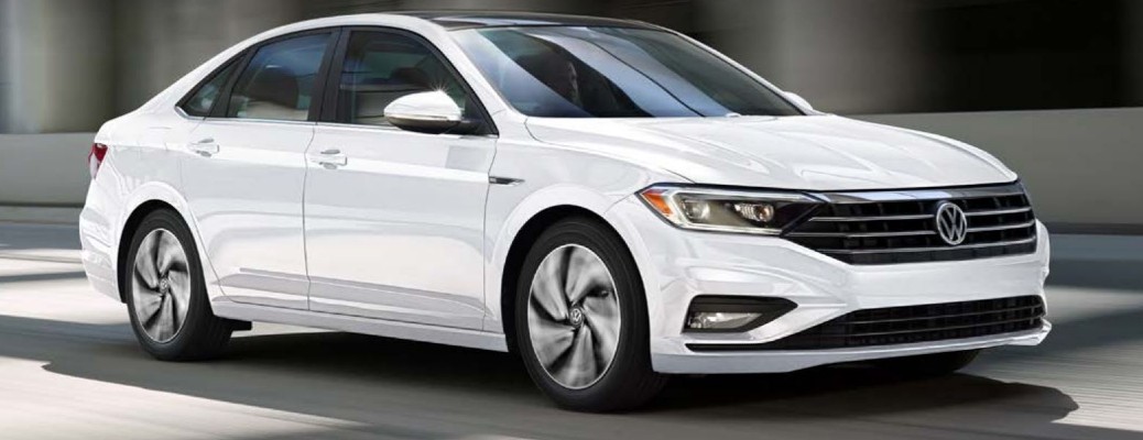White 2020 Volkswagen Jetta driving down street