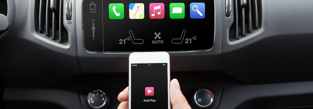 Person connecting smartphone to vehicle