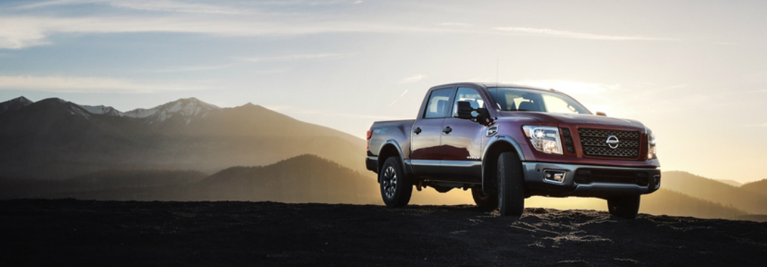 2018 Nissan TITAN parked in front of mountains at sunrise