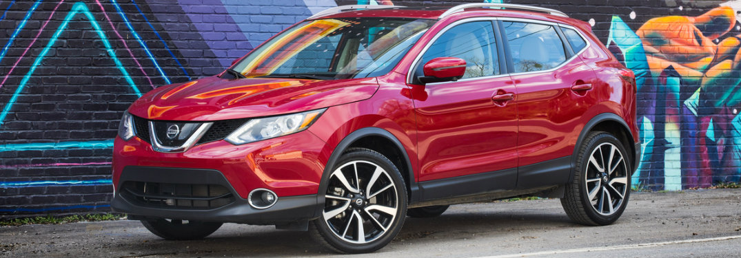 2018.5 Nissan Rogue Sport parked in front of a colorful mural