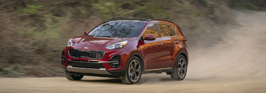 2020 Kia Sportage driving down a gravel road