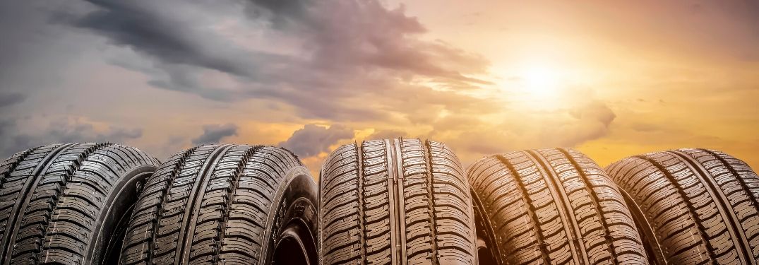 Five tires in front of sunset