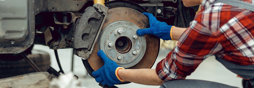 Woman changing brakes