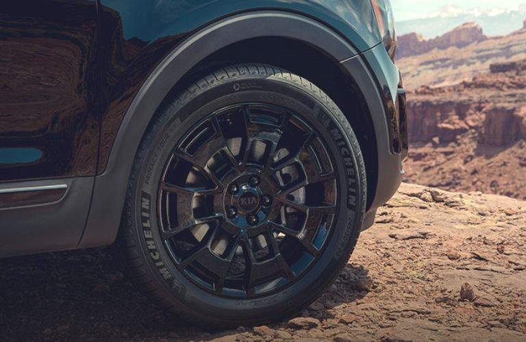 2022 Kia Telluride wheel image on mountain terrain