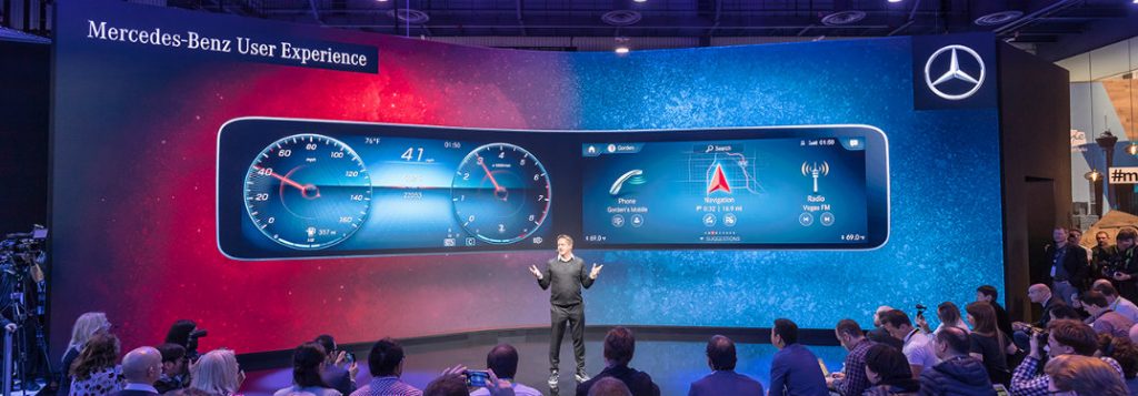 man highlighting the features of the new mercedes-benz user experience