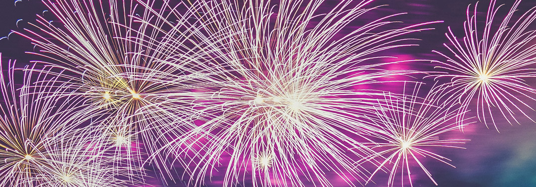 pink fireworks on a black sky