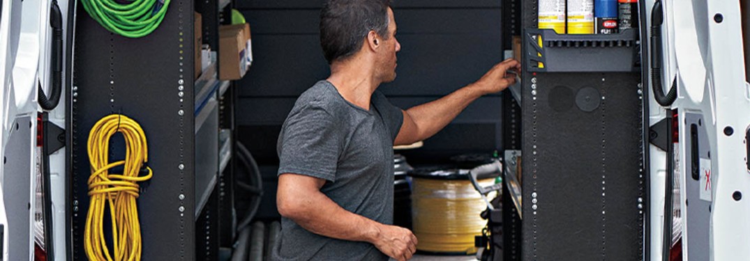 a man loading a Mercedes-Benz van