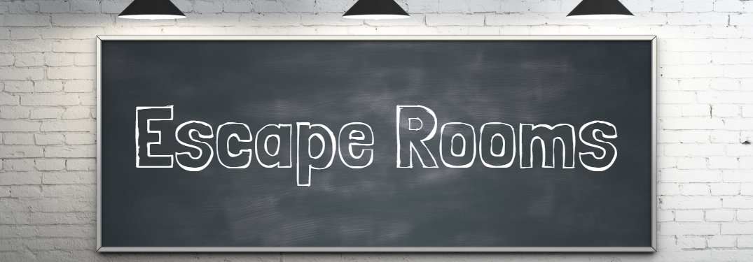 escape rooms text on a blackboard