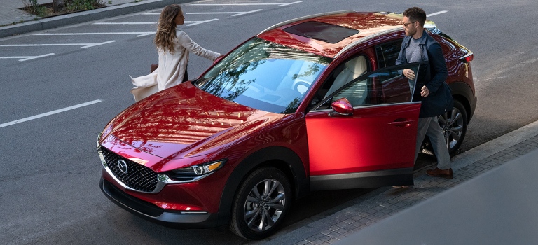 2020 Mazda CX-30 with man and a woman getting in