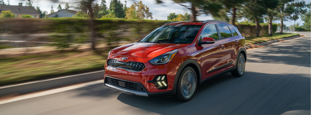Front view of red 2020 Kia Niro Touring on the road