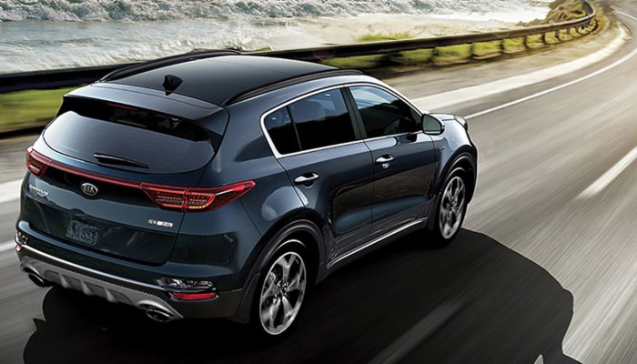 2020 Kia Sportage driving down a winding road