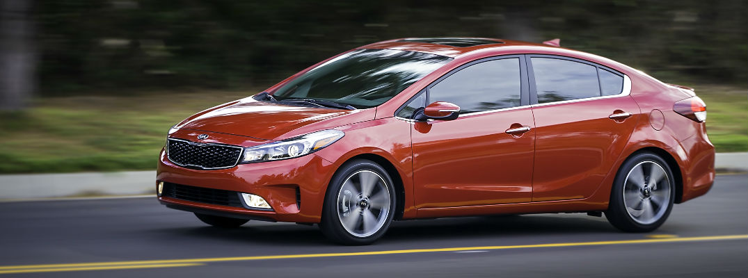 2017 Kia Forte driving down a rural road