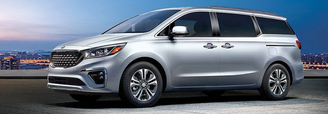 2020 Kia Sedona driving down a highway road at night
