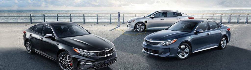 Three 2020 Kia Optima models parked in a pier