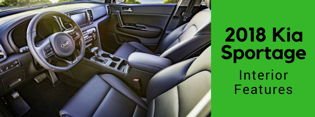 Front seats and dash of 2018 Kia Sportage with green banner