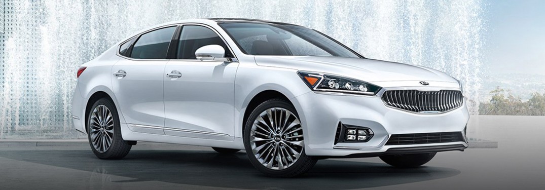 2019 Kia Cadenza white parked in front of water fountains