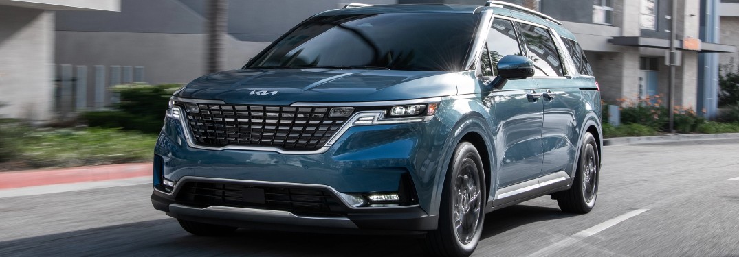 2022 Kia Carnival MPV blue coming down street