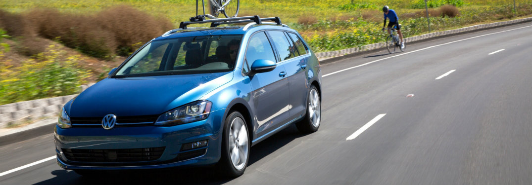 2015 Volkswagen Golf SportWagen with cyclist riding in background