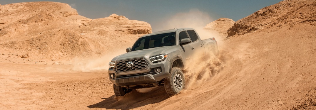 2020 Toyota Tacoma gray going down sand