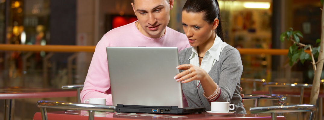 Couple browsing the internet on a laptop