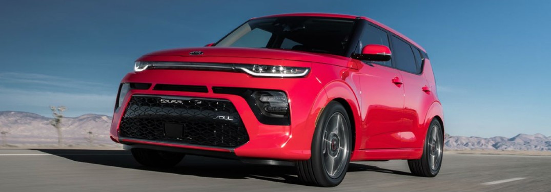 2021 Kia Soul red exterior front fascia driver side driving in desert area