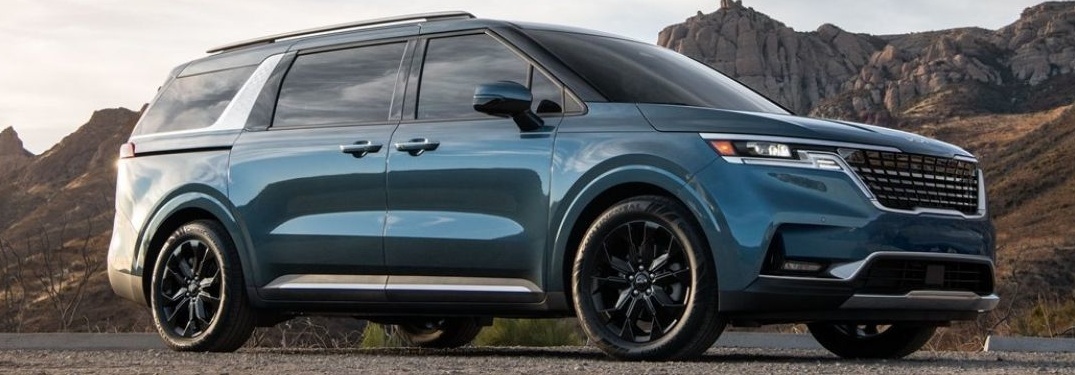 2021 Kia Carnival with hill in the background