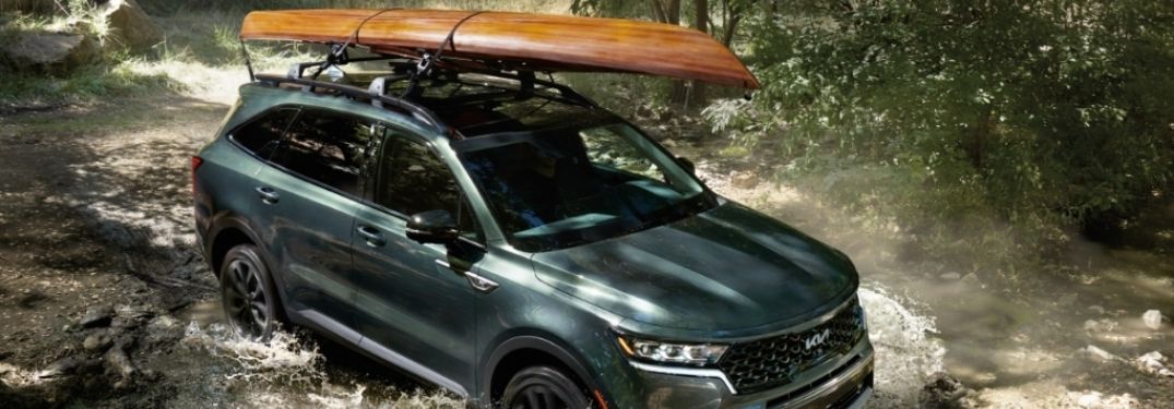 2022 Kia Sorento carrying load on top and driving through water
