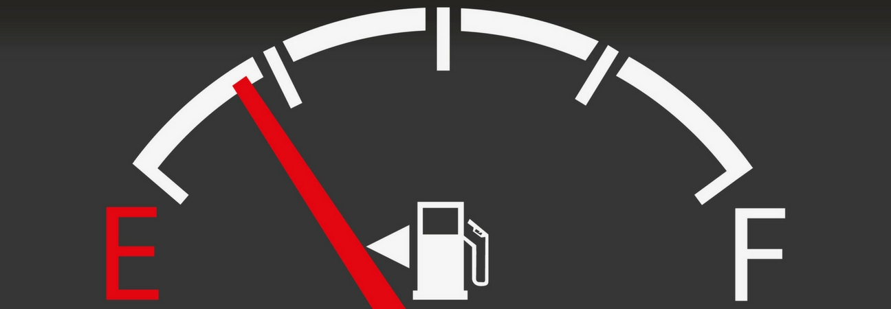 A close up of a gas gauge featured in a blog post about gas mileage