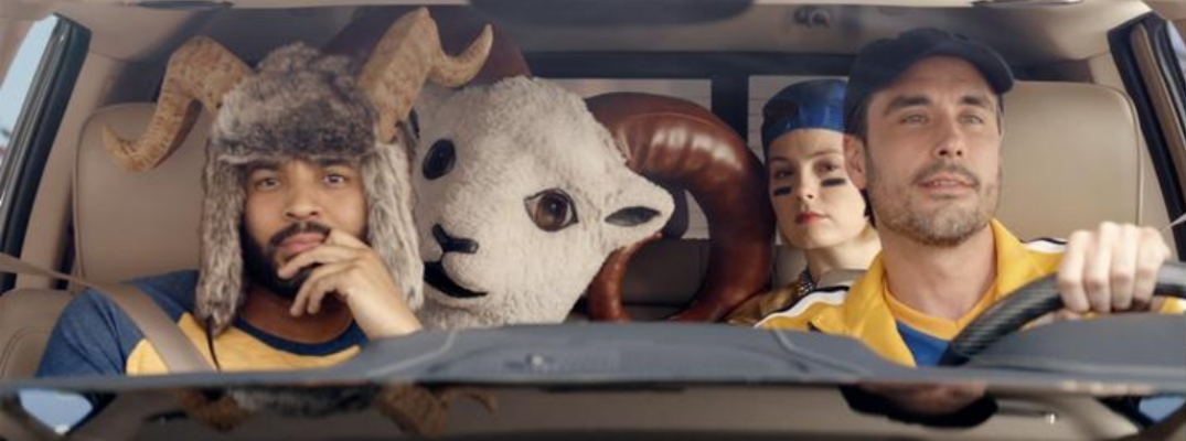 Three Rams fans in Ram truck with Ram mascot