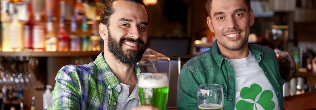 two guys celebrating St. Patrick's day in pub