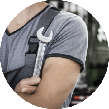 mechanic holding wrench