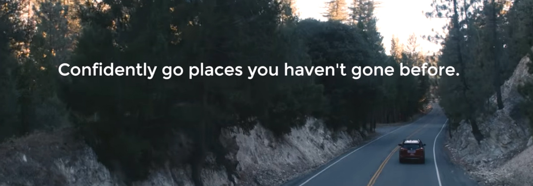 2018 Toyota RAV4 Adventure driving through the woods with overlapping words that say confidently go places you haven't gone before