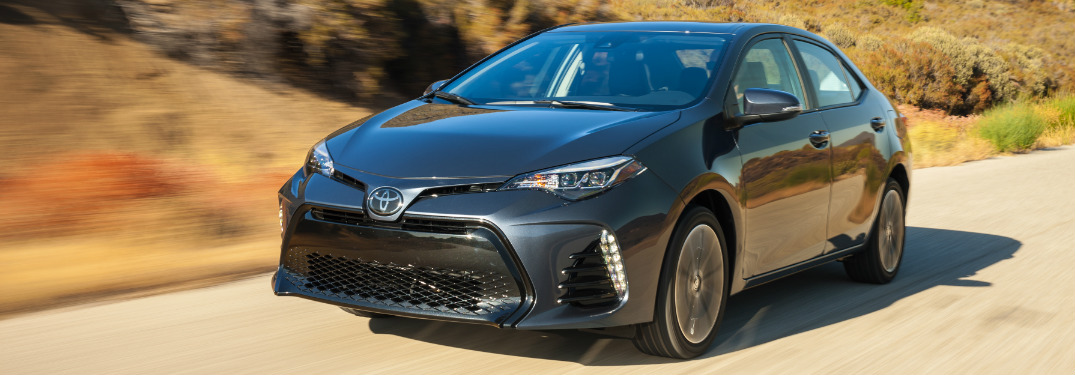 2018 Toyota Corolla in gray driving down a desert road