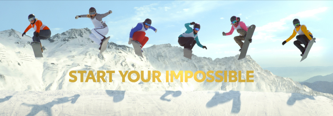 Toyota commercial still featuring 6 snowboarders in the air with the words start your impossible