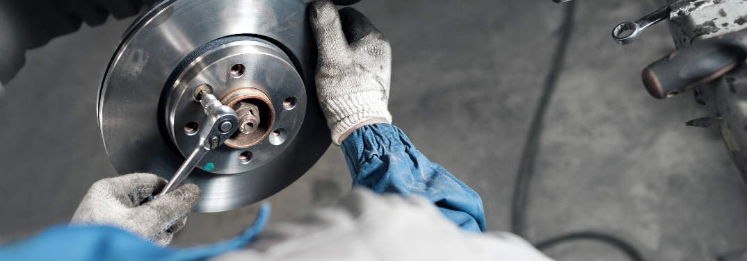 Mechanic working on brake parts