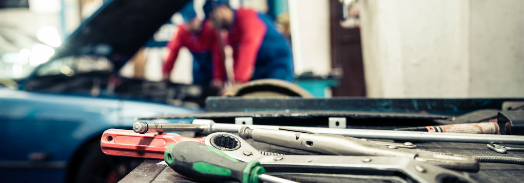 Mechanics working on a car