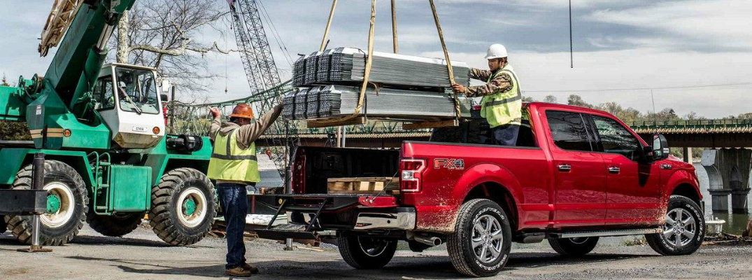 Workers Loading up the Bed of a 2018 Ford F-150