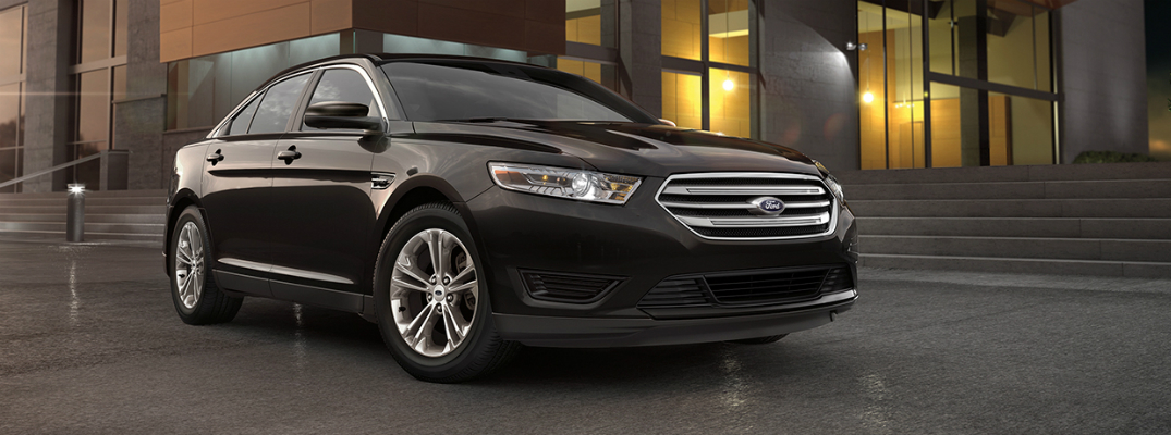 2018 Ford Taurus Parked Next to Flight of Stairs