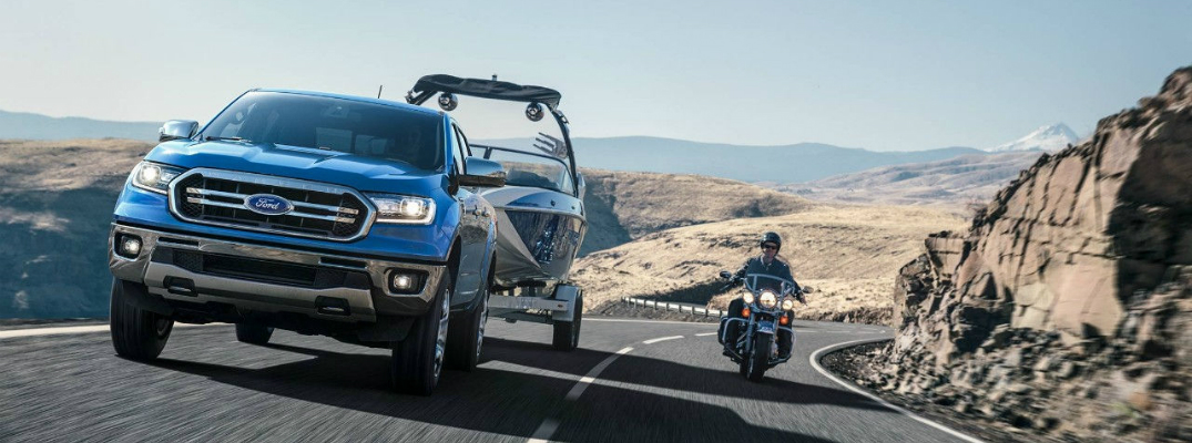 2019 Ford Ranger Driving Next to a Motorcycle