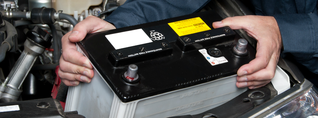 Mechanic Removing a Car Battery